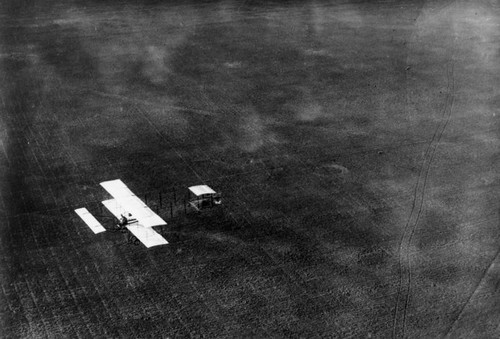 Another aerial view of a biplane in flight