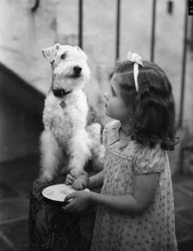 Small girl with a dog, view 2