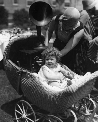 Woman, baby and portable radio