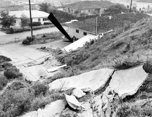 Bank of earth at right moved down 150-foot hill to destroy Valley garage