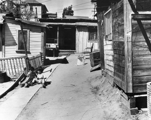 Young boys playing in the alley, slum homes