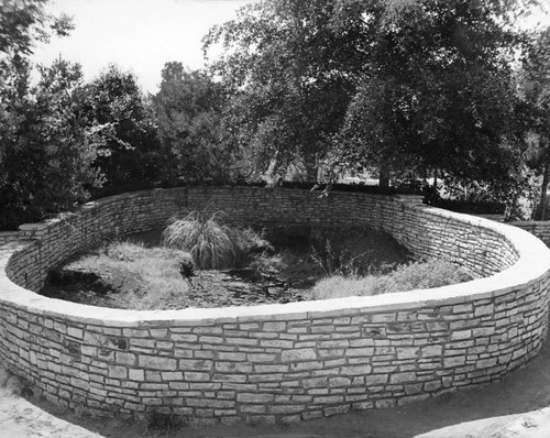 Pit surrounded by stone wall, view 3