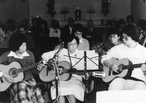 Altar Society guitarists in church service