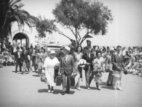 Crowds wait for the arrivals to pass by in Avalon