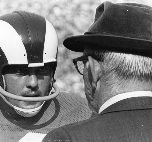 Prothro talks to his player