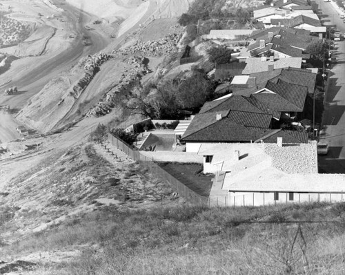 Huge slide threatens homes to the right of San Diego Freeway Cut