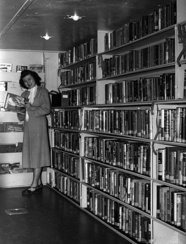 Library empoyee inside an LAPL Traveling Branch Bookmobile