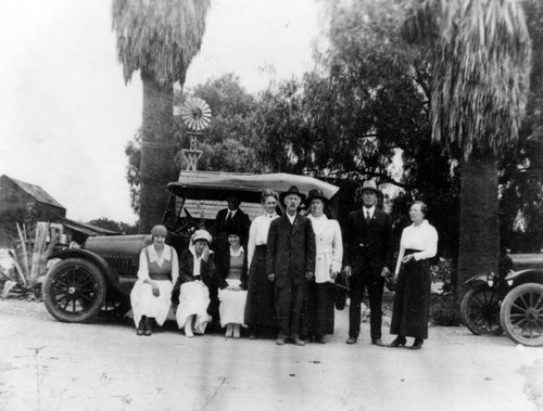 Family in front of their farm