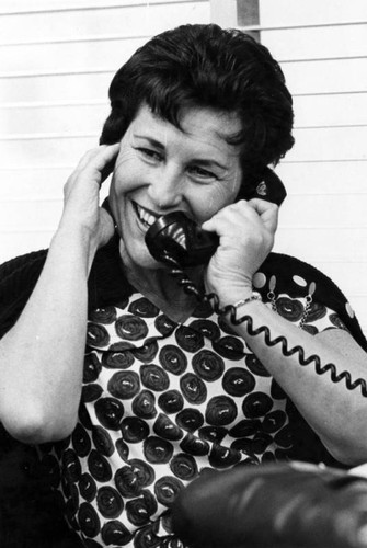 Mrs. Gladys Bazell waits to talk to her son, Frank, by overseas telephone