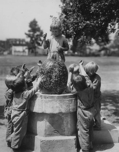 Orphan children and watermelon