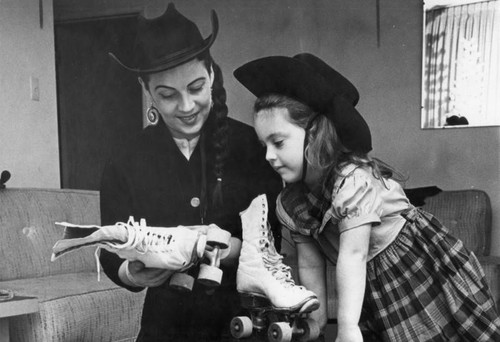 Daughter Robin, 5, admires mother's flying wheels