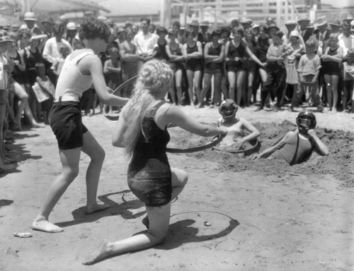 Beach beauties tossing hoops