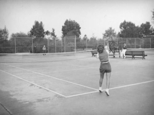 Playing tennis at Exposition Park