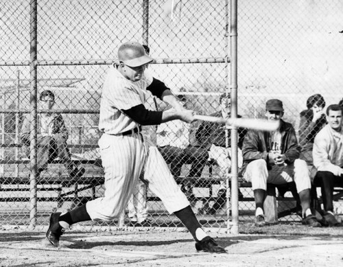 Reseda's outfielder Jim Huenmier takes healthy swing