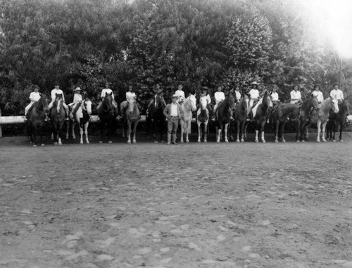 Unidentified young girls ride horseback