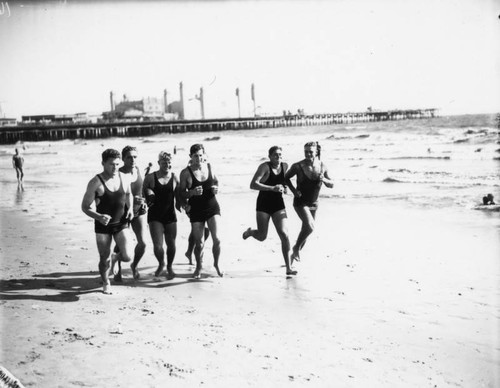 Football team works out on the beach