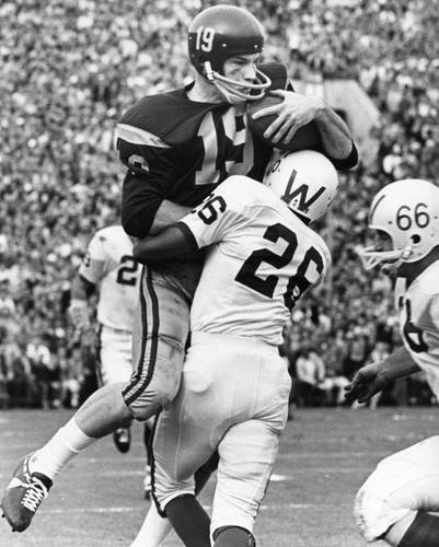 USC's great Hal Bedsole (19) gathers TD pass