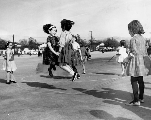 Girls jumping rope