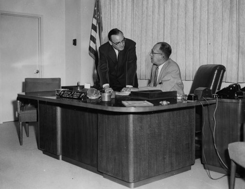 Police Chief William H. Parker behind his desk