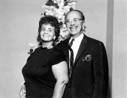 Unidentified woman and man at holiday party