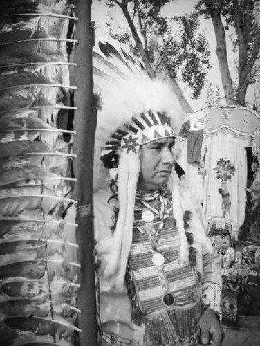 Man in Indian headdress at the Farmers Market Fall Festival