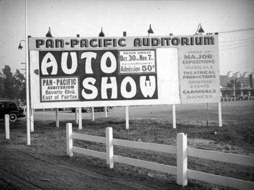 Auto show billboard at the Pan-Pacific Auditorium