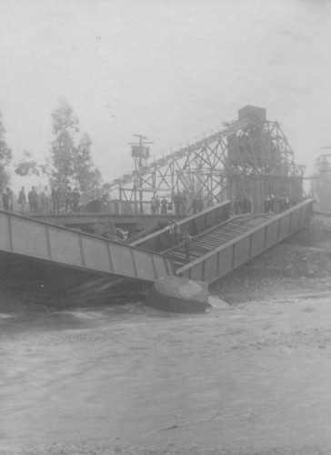 Bridge collapses by flood waters