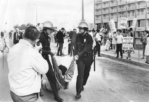 Police removing protester from Century City demonstration