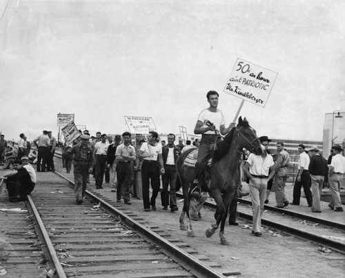 Strikers parade outside aviation plant