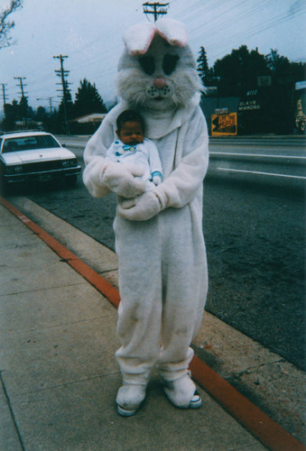 Easter rabbit holding infant