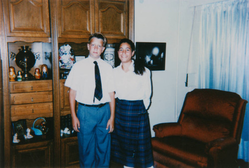 Brother and sister in family living room