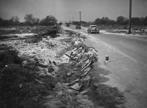 Road damaged by the flood in El Monte