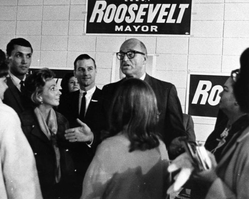 Mayoral candidate James Roosevelt talks to supporters