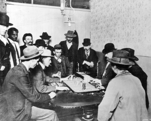 Gamblers seated at gaming table