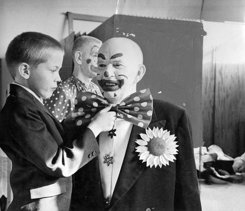 Business men 'clown' for children