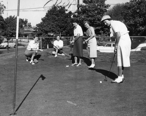 Golf queen struts her stuff