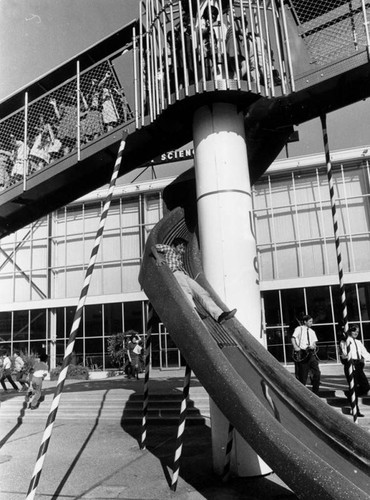 Sliding down a large slide