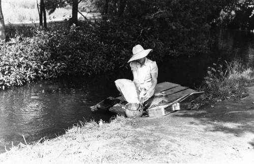 Woman cleaning a frog