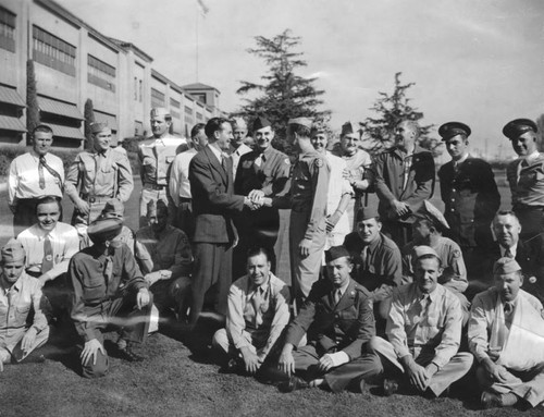 Leonard Firestone greets wounded soldiers