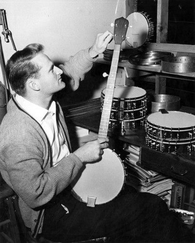 Bill Robson assembles five-string banjo in workshop