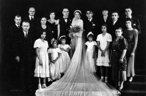 Wedding portrait of newlyweds and family