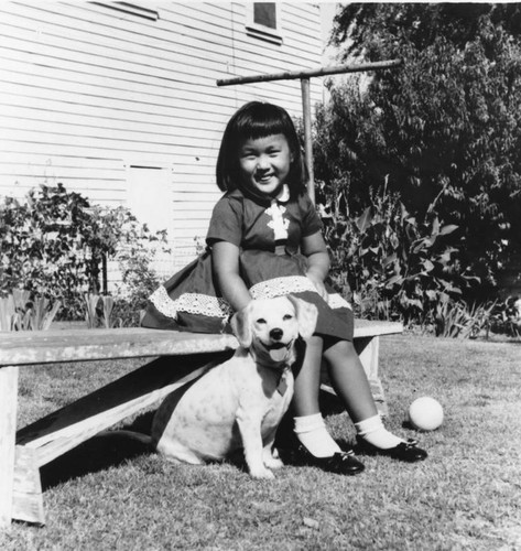 Japanese American girl with pet dog