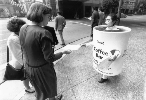 Walking cup advertising for coffee bar