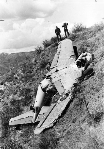 Firemen inspect wreckage of crashed plane in Newhall