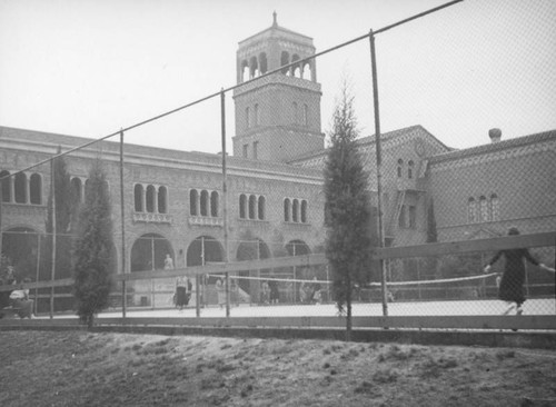 Playing tennis at Belmont High School