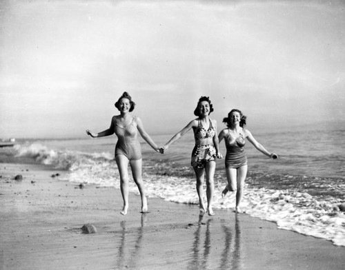 Three young women on the beach