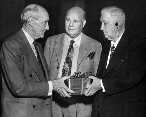 Jim Wilson holds scroll of honor for civic work — Calisphere