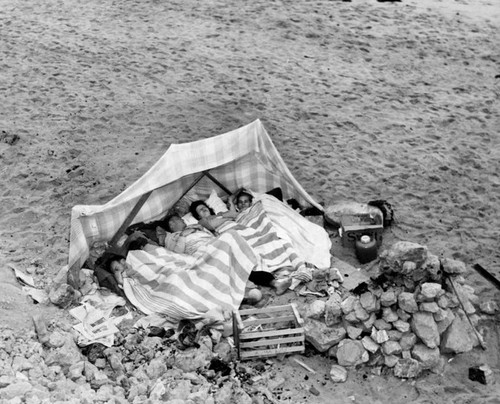 Family camping on Santa Monica Beach