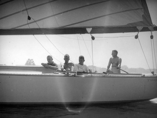 Four men in a sailboat