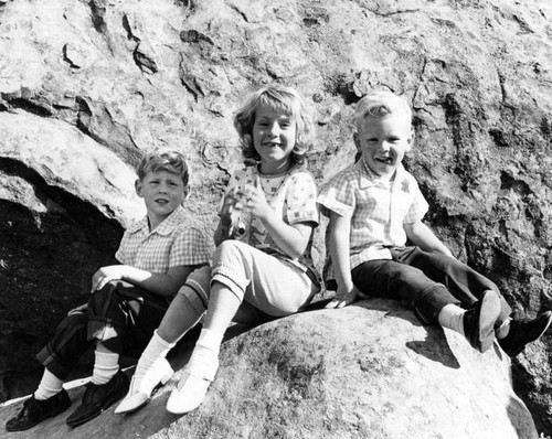 Mark, Pamela and Bret Greening relax on massive rocks